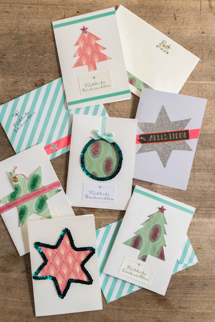 DIY Weihnachtskarten aus Papier mit Washi Tape, Glitzer, Aufklebern und Stempeln